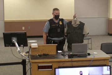 Minneapolis Park Police Sgt. Adam Swierczek showing park commissioners the now abandoned uniform design.