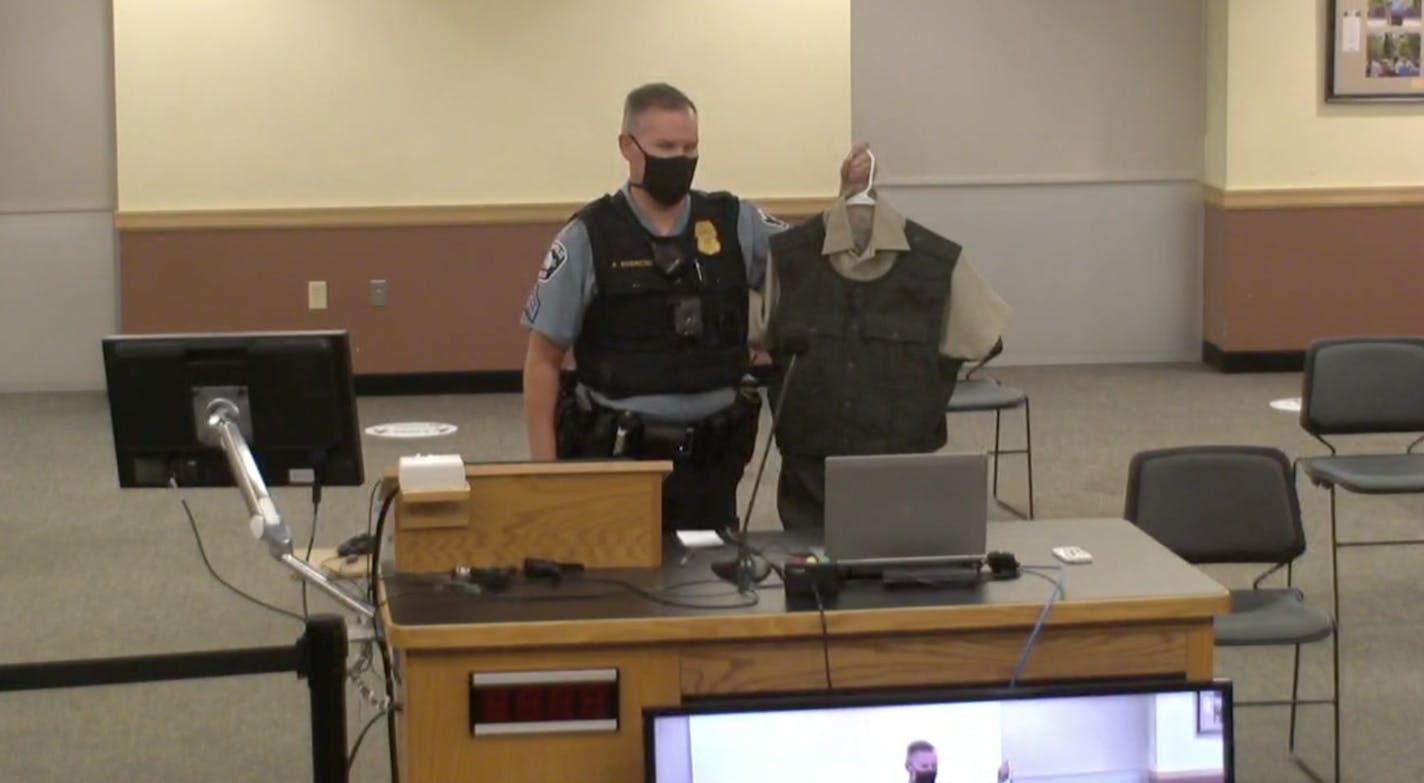 Minneapolis Park Police Sgt. Adam Swierczek showing park commissioners the now abandoned uniform design.