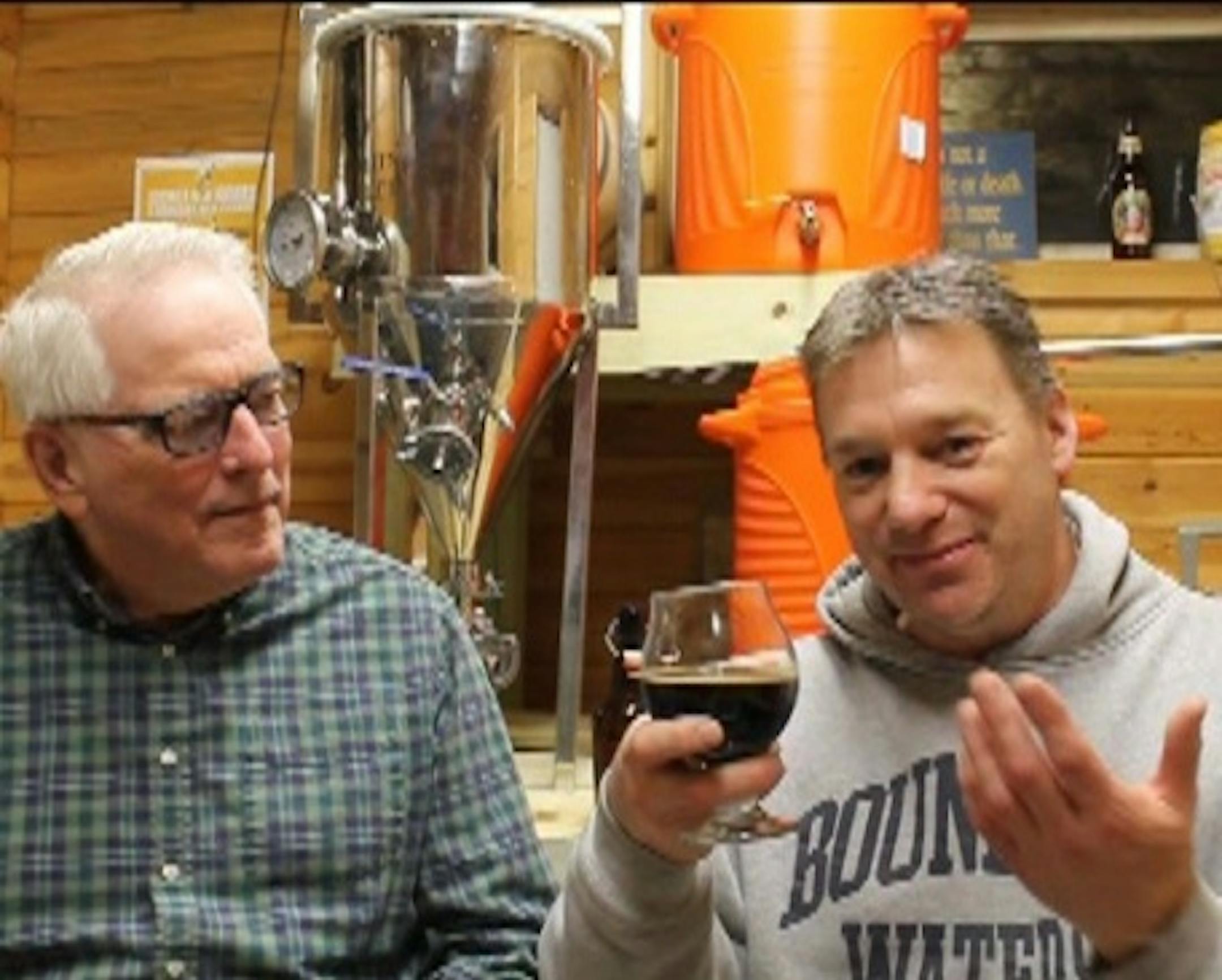 Mike Jankovec, right, discusses beer brewing with Terry Jackson, left, on a show aired on Ely TV's channel 11, a community-access cable channel.
