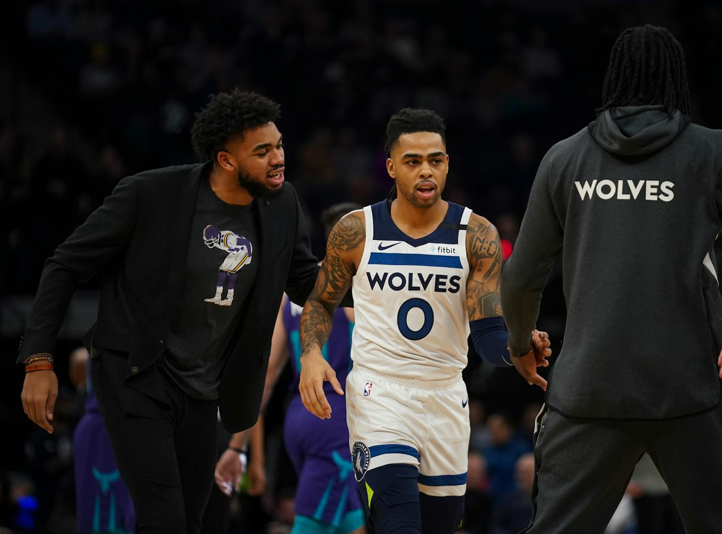 An injured Minnesota Timberwolves center Karl-Anthony Towns had encouraging words for Minnesota Timberwolves guard D'Angelo Russell (0) at a first quarter timeout. ] JEFF WHEELER • Jeff.Wheeler@startribune.com