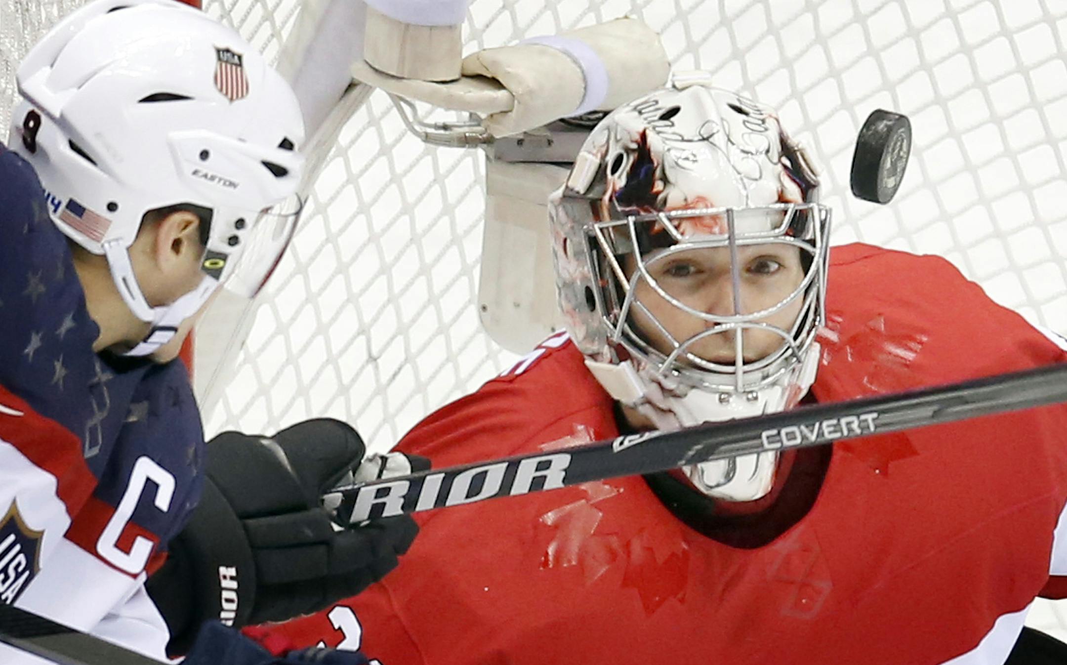 Team USA captain Zach Parise (9) and team Canada goalie Carey Price (31) in the first period. Canada beat USA 1-0. ] CARLOS GONZALEZ cgonzalez@startribune.com - February 21, 2013, Sochi, Russia, Sochi 2014 Winter Olympics, Bolshoy Ice Dome, men's hockey semifinal, USA vs. Canada