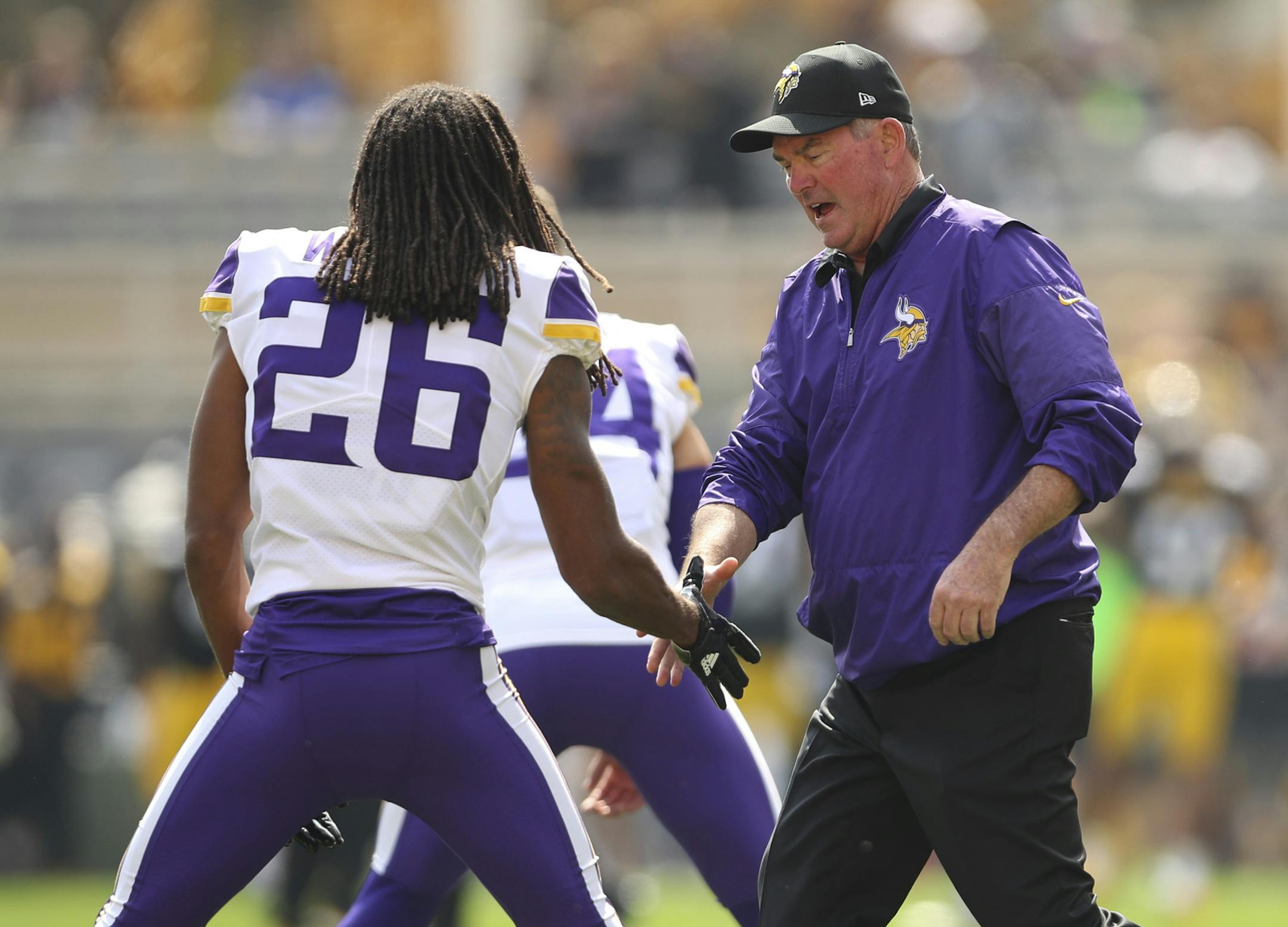 Minnesota Vikings head coach Mike Zimmer greeted players, including Minnesota Vikings cornerback Trae Waynes (26) as they stretched before Sunday's game against the Steelers. ] JEFF WHEELER ï jeff.wheeler@startribune.com The Minnesota Vikings faced the Pittsburgh Steelers in an NFL football game Sunday afternoon, September 17, 2017 at Heinz Field in Pittsburgh.