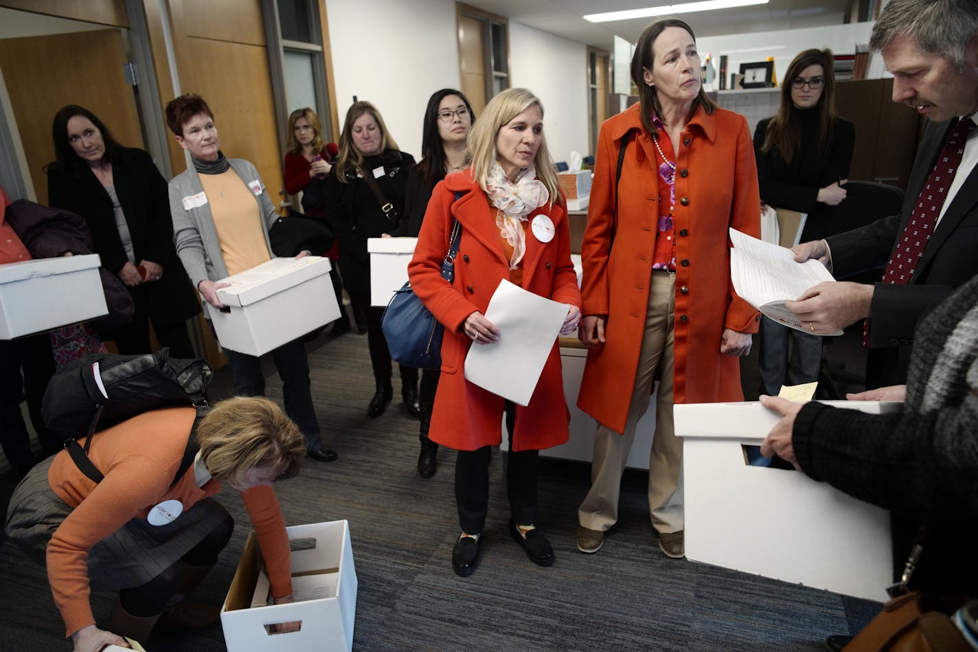 Kay Bromelkamp,left and Anne Sterner, both of Elder Voice Family Advocates delivered reports of elder abuse to Senator Tony Lourey (DFL) District 11 at his office. Lourey is supporting the women's efforts to address the issue.] Families of elder abuse victims will descend on the State Capitol on Monday, April 9th. Frustrated by legislative inaction on certain key proposals, they will be delivering hundreds of pages of maltreatment reports to lawmakers. Richard Tsong-Taatarii&#xef;rtsong-taatarii