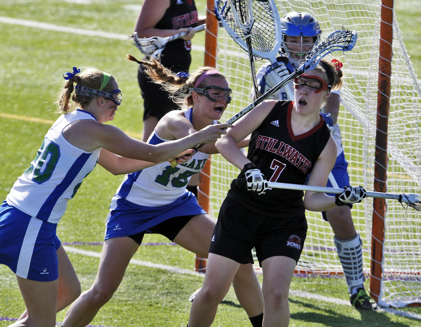 Girl's Lacrosse tournament. Stillwater vs. Blake.. Blake applied defensive pressure to Stillwater's Katherine sheely (7) as she attempted to make a shot on goal. (MARLIN LEVISON/STARTRIBUNE(mlevison@startribune.com (cq program )