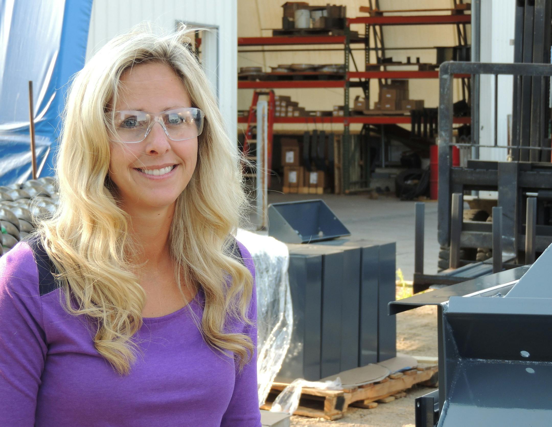 Nicole Klimek, owner of Lowry Manufacturing Co., on a tour of the business.