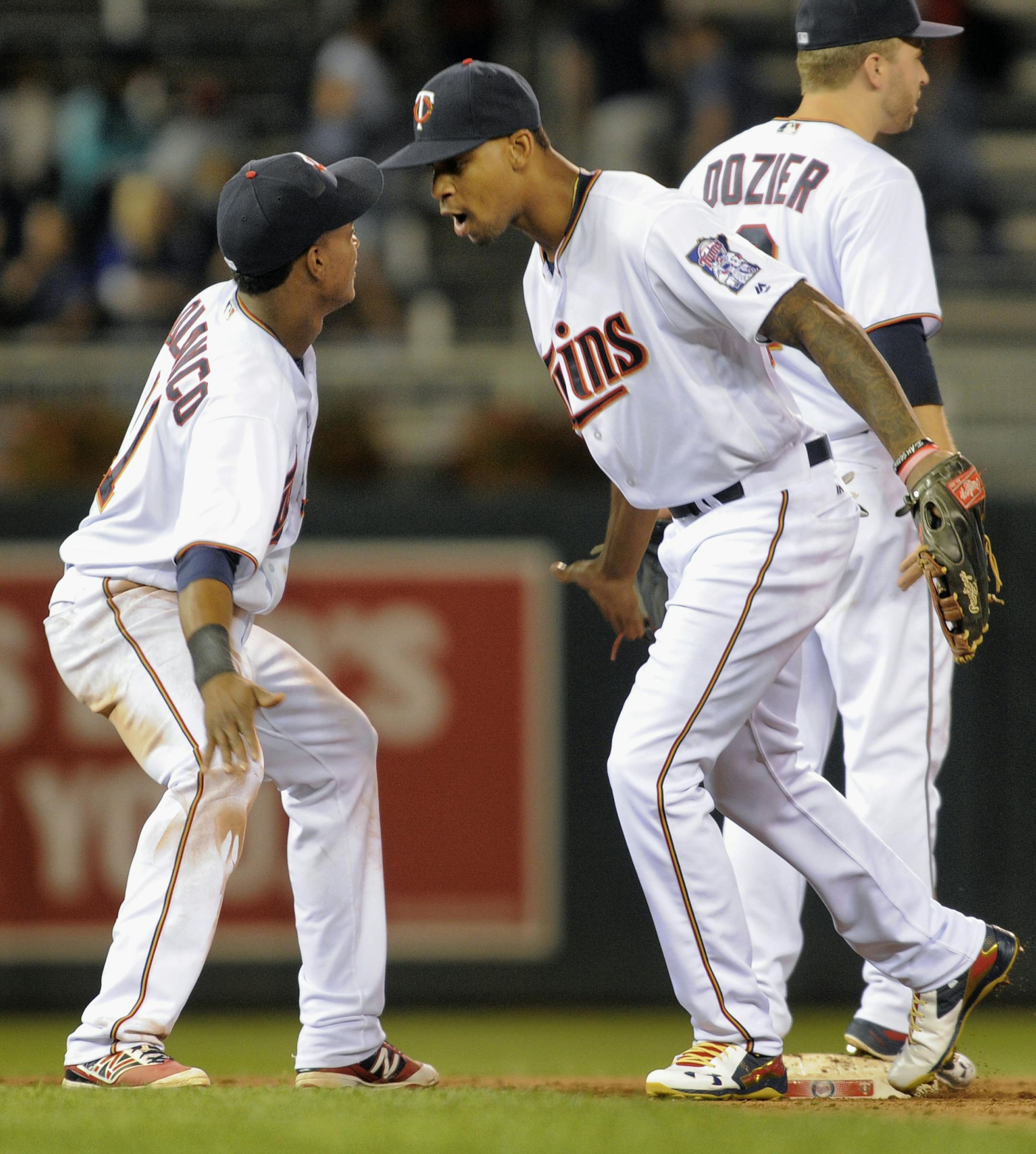 Minnesota Twins' Byron Buxton, front right, and Jorge Polanco, left, celebrate after defeating the Chicago White Sox in a baseball game, Thursday, Sept.. 1, 2016, in Minneapolis. (AP Photo/Tom Olmscheid)