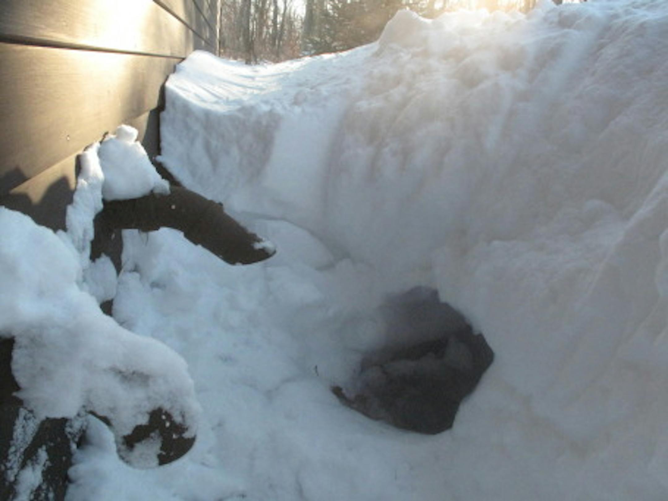 The furnace air intake (at left) and the exhaust (right) after being dug out of a deep snow drift.