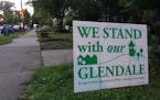 Signs have sprouted around the Prospect Park neighborhood in support of saving the Glendale row houses from being razed.
