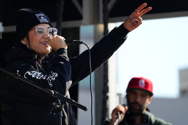 Maria Isa Pérez-Hedges, who is running for the Minnesota House of Representatives District 65B in Saint Paul, sings as she performs during the Rise f