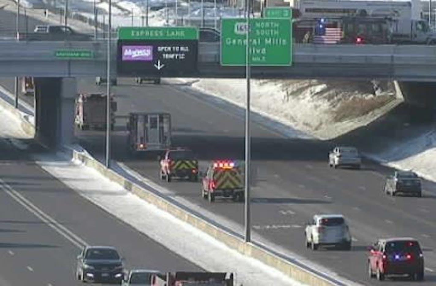 Fire personnel on an I-394 overpass paid their respects to Howard Lake Fire Chief Daryl &#x201c;Taddy&#x201d; Drusch, who died this week after responding to an emergency call. Credit: MnDOT camera