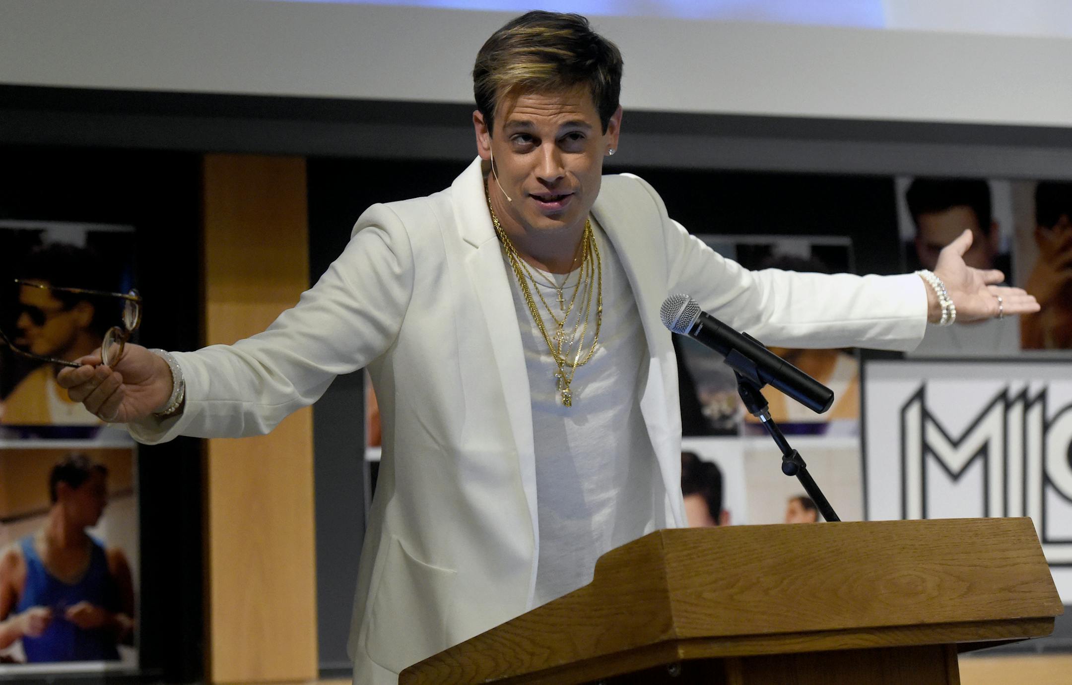 FILE - In this Jan. 25, 2017, file photo, Milo Yiannopoulos speaks on campus in the Mathematics building at the University of Colorado in Boulder, Colo. Right-wing provocateur Yiannopoulos was trying to clarify past comments on relationships between boys and older men after a conservative site posted a collection of edited video clips that set social media abuzz. After the polarizing Breitbart News editor was invited this weekend to speak at the annual Conservative Political Action Conference sp