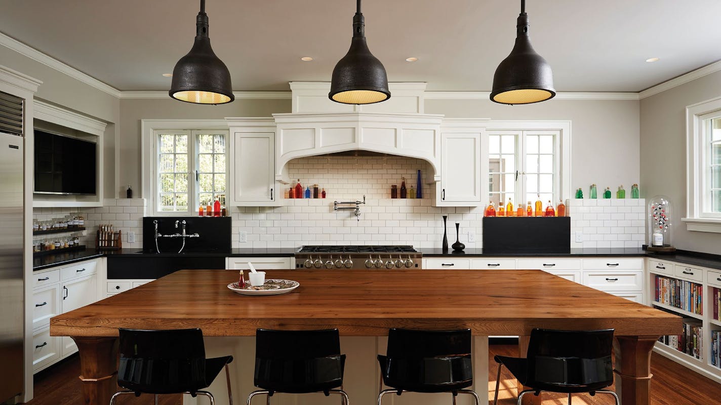 A turn-of-the-century chemistry lab and the home's original Tudor elements influenced the design of the remodeled kitchen.