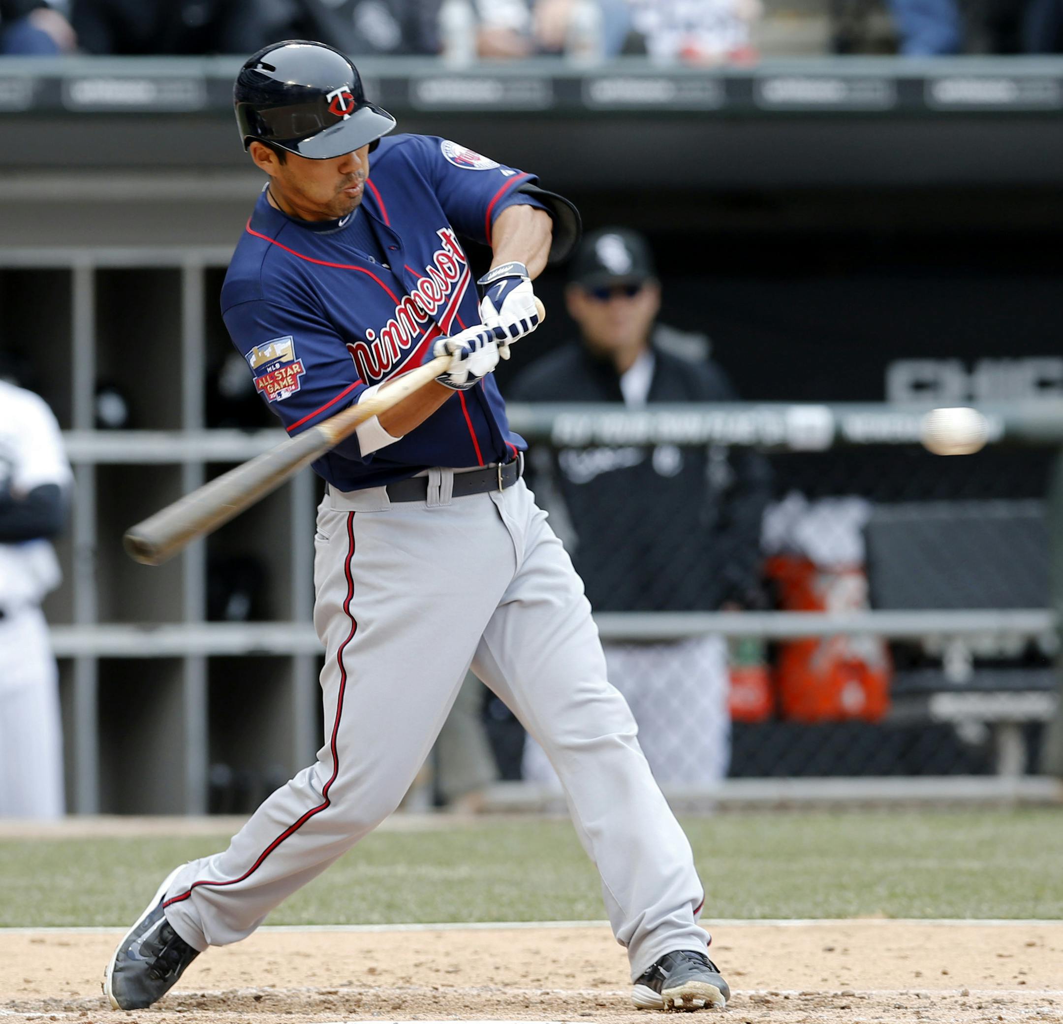 Minnesota Twins' Kurt Suzuki hits a two-run double off Chicago White Sox starting pitcher Chris Sale, scoring Oswaldo Arcia, and Aaron Hicks, during the third inning of an opening day baseball game Monday, March 31, 2014, in Chicago. The White Sox won 5-3. (AP Photo/Charles Rex Arbogast)