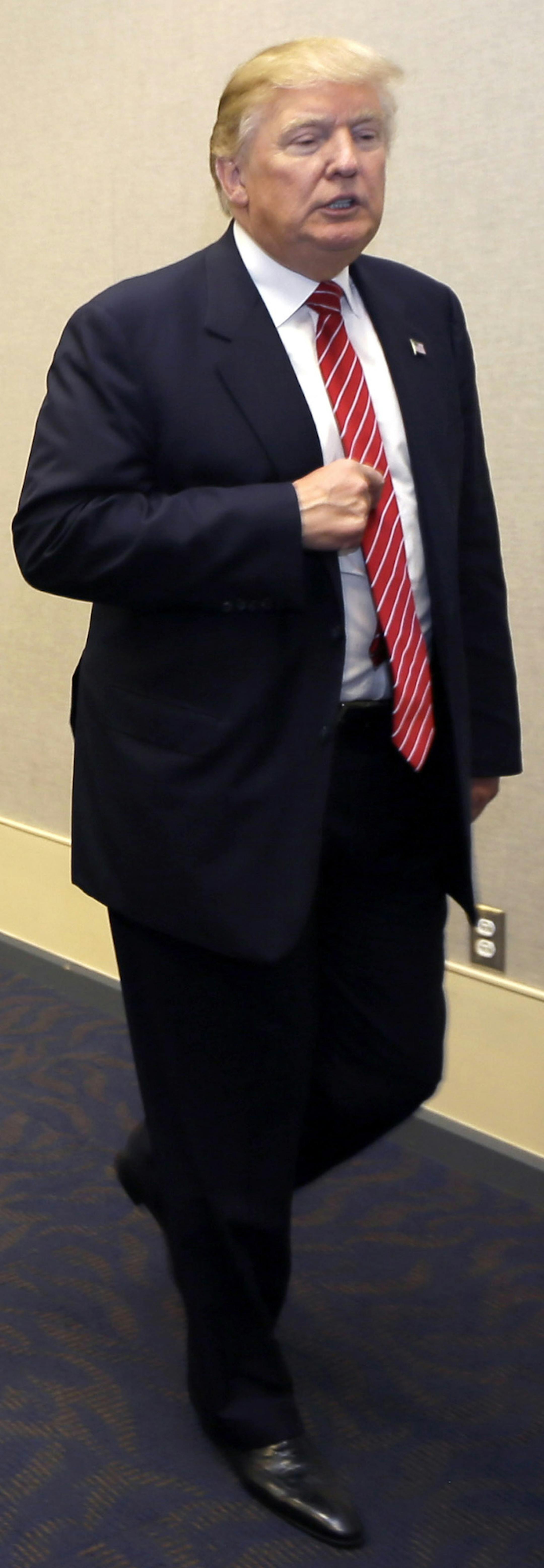 Republican presidential hopeful Donald Trump leaves a news conference before addressing the Republican Party of Arkansas Reagan Rockefeller dinner in Hot Springs, Ark., Friday, July 17, 2015. (AP Photo/Danny Johnston) ORG XMIT: MIN2015072413151037