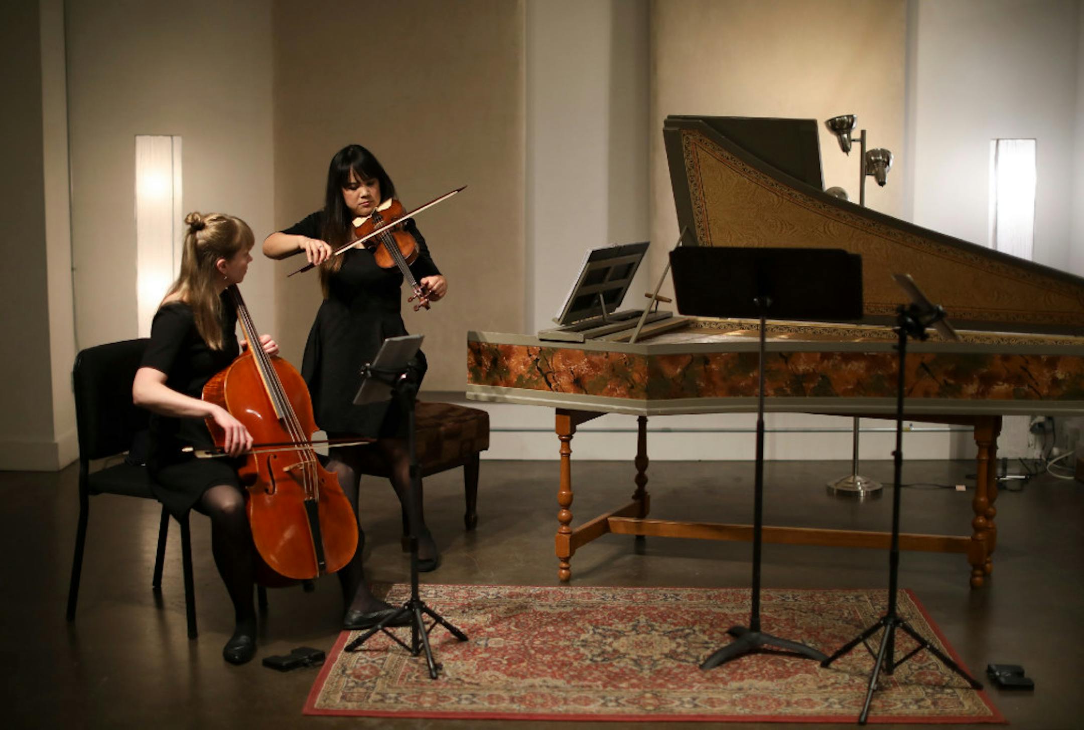 Cellist Andrea Stewart and violinist Sallynee Amawat with Infusion Baroque tuned up before performing at St. Paul’s Baroque Room.