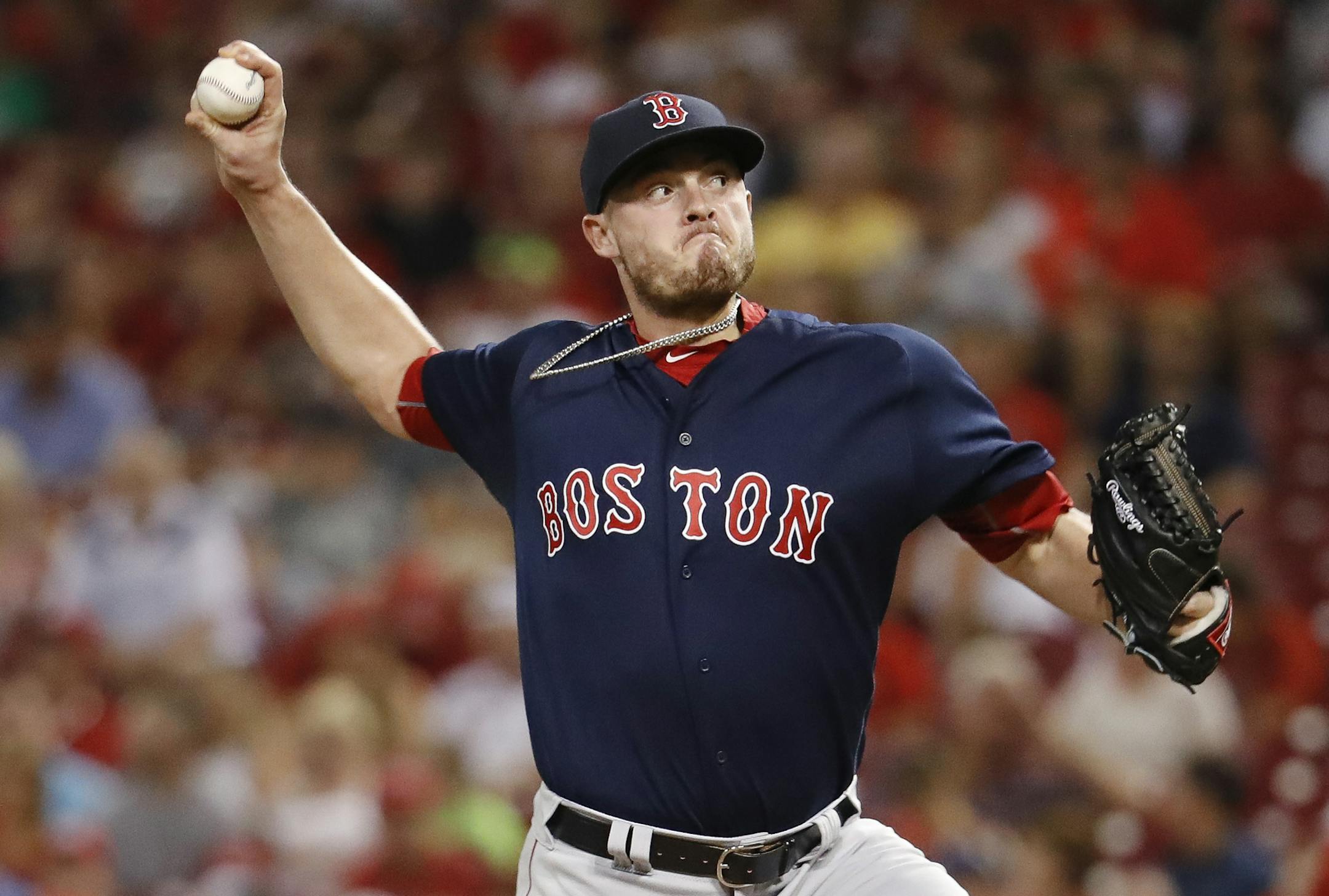 FILE - In this Sept. 22, 2017, file photo, Boston Red Sox relief pitcher Addison Reed throws in the eighth inning of a baseball game against the Cincinnati Reds in Cincinnati. The right-handed reliever and the Minnesota Twins finalized a $16.75 million, two-year contract over the weekend, putting another pitcher with closing experience in the back of the Twinsí bullpen. (AP Photo/John Minchillo, File)