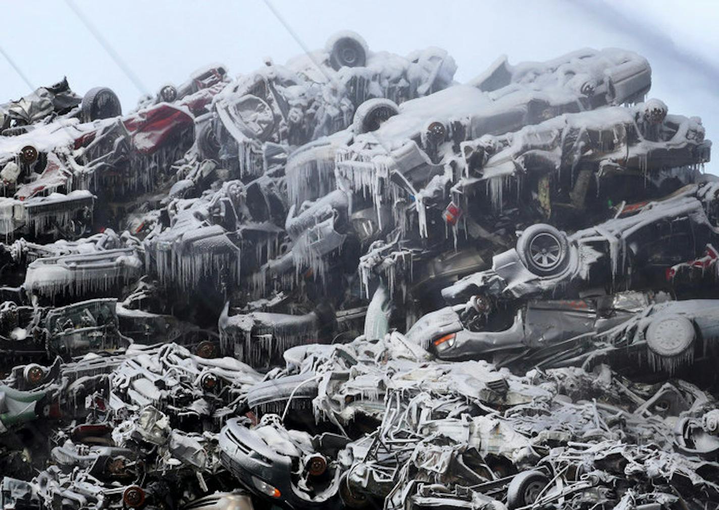 Star Tribune photo by David Joles
Ice covered junk vehicles at the Northern Metal Recycling plan in Becker, Minn., as firefighters worked to contain a long-burning fire there on Feb. 19.