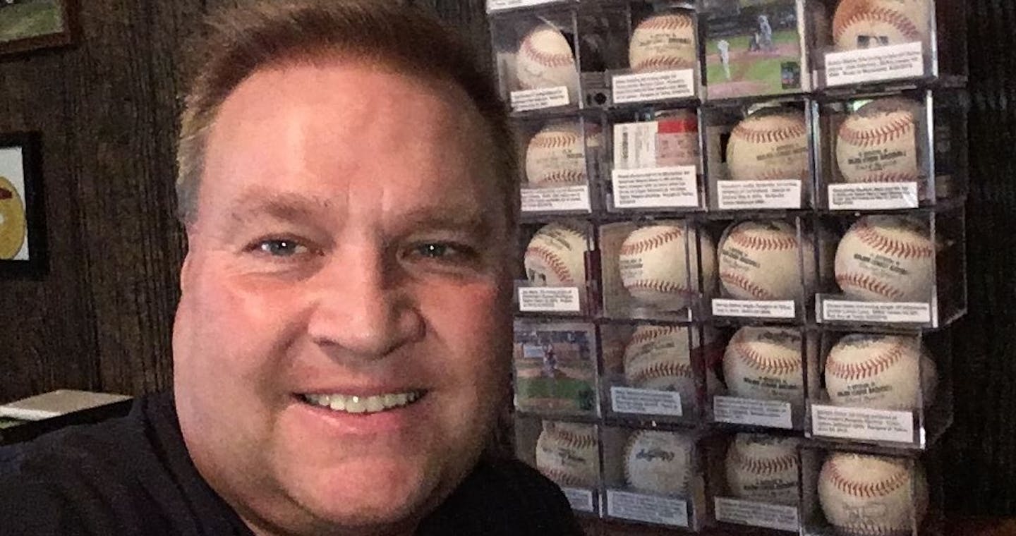 Jason Gabbert, with a partial collection of baseballs he has amassed attending Major League Baseball games. (Courtesy Jason Gabbert)