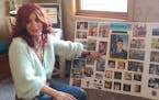 Erica Zimmermann with photo boards from the funeral of her husband, Brian. The Gulf War veteran, suffering from PTSD, killed himself last summer after