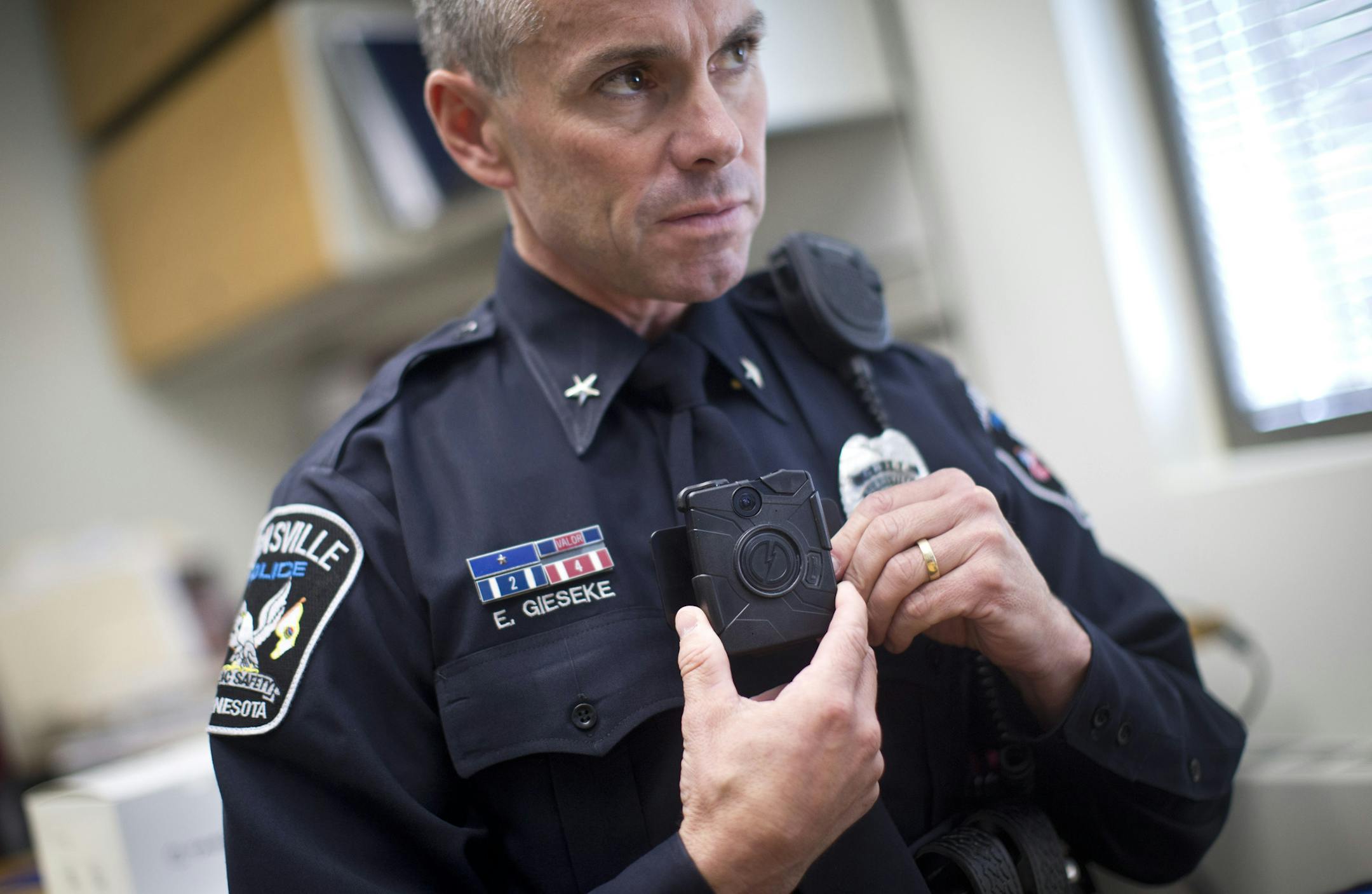 Chief Eric Gieseke showed how one of the body camera's several police officers on the Burnsville Police Department wear on patrol on Monday, October 21, 2013, in Burnsville, Minn. This is the third year the Burnsville Police Department has used these body cameras. ] RENEE JONES SCHNEIDER &#x2022; reneejones@startribune.com