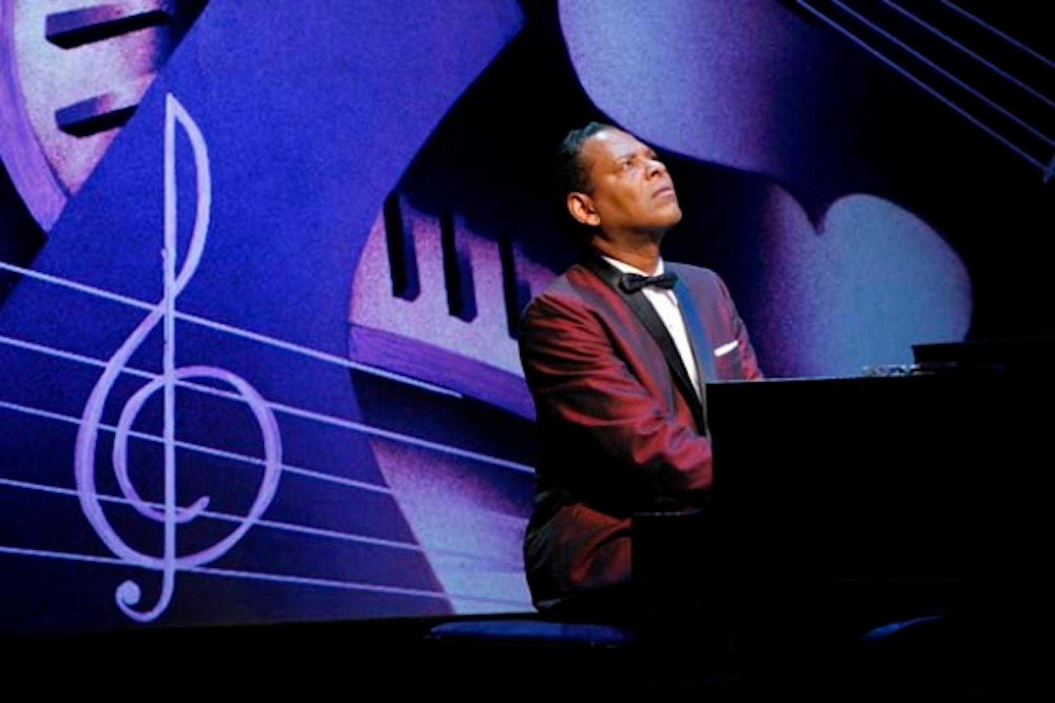 Dennis W. Spears (Nat Cole) in the Penumbra Theatre production of I Wish You love by Dominic Taylor, at Penumbra Theatre April 21 - May 22, 2011. Directed by Lou Bellamy, scenic design by Lance Brockman, costume design by Mathew J. LeFebvre, lighting design by Don Darnutzer.