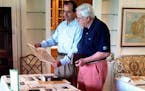 Abbot Downing chief historian Andy Anderson (at right) and director Matt Robertson review a client&#xed;s family history in Massachusetts. (Photo cour