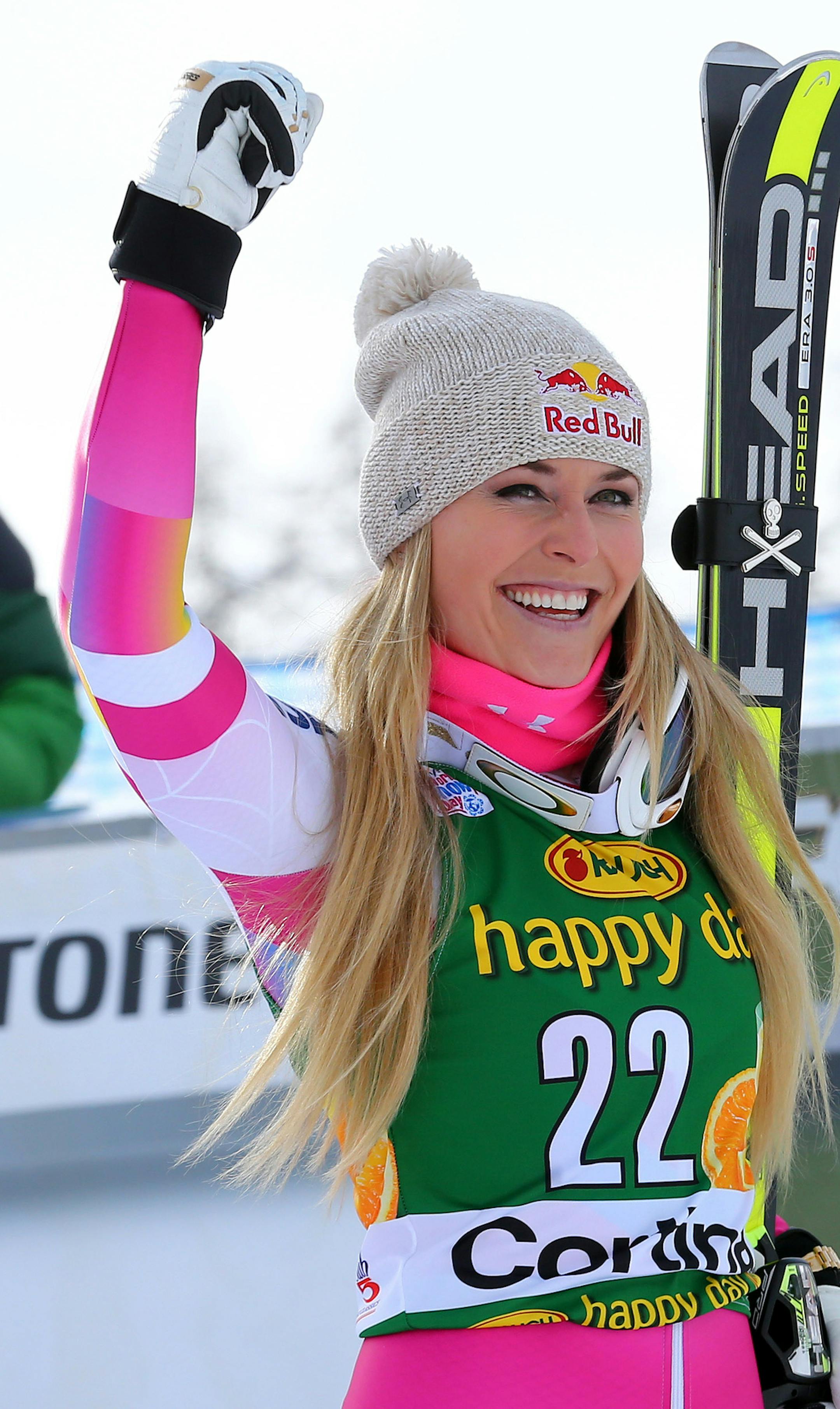 Lindsey Vonn celebrates after winning an alpine ski, women's World Cup super-G, in Cortina d'Ampezzo, Italy, Monday, Jan. 19, 2015. (AP Photo/Armando Trovati)