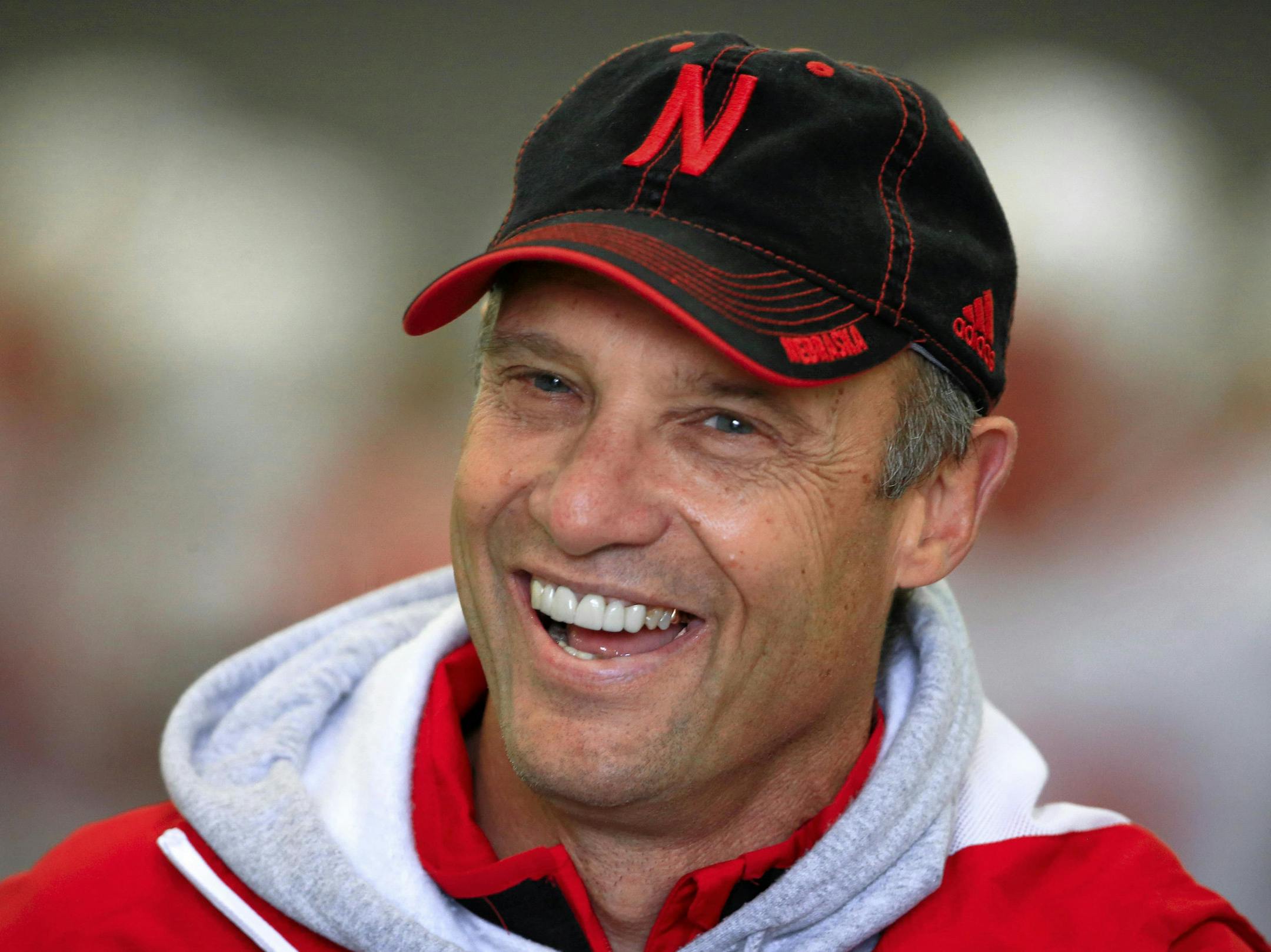 FILE - In this April 8, 2015, file photo, Nebraska head coach Mike Riley smiles during an NCAA college football spring practice in Lincoln, Neb. Riley is a month away from opening practice for his first season coaching at Nebraska. (AP Photo/Nati Harnik, File) ORG XMIT: NENH201