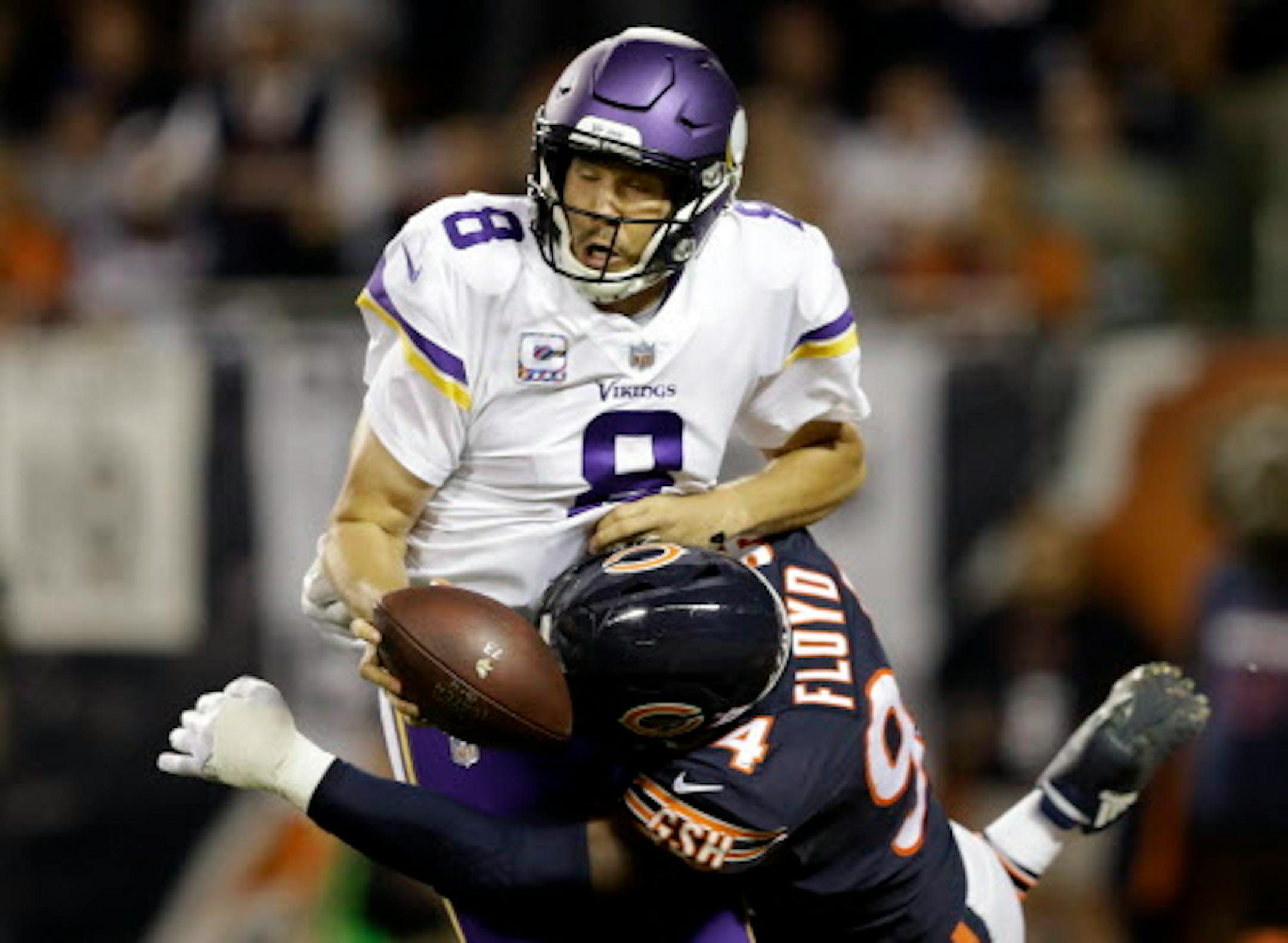 Chicago Bears outside linebacker Leonard Floyd (94) tackles Minnesota Vikings quarterback Sam Bradford (8) for safety during the first half of an NFL football game, Monday, Oct. 9, 2017, in Chicago. (AP Photo/Darron Cummings)