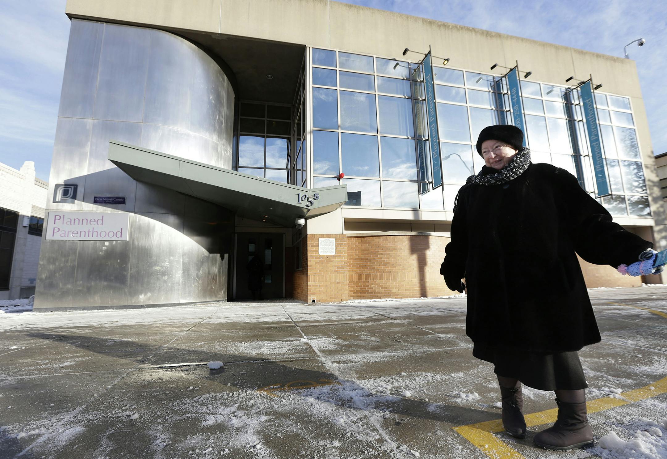 FILE -This Dec. 17, 2013 file photo shows anti-abortion protester Eleanor McCullen, of Boston, standing at the painted edge of a buffer zone outside a Planned Parenthood location in Boston. The Supreme Court has struck down a 35-foot protest-free zone outside abortion clinics in Massachusetts. The justices were unanimous Thursday that extending a buffer zone 35 feet from clinic entrances violates the First Amendment rights of protesters. (AP Photo/Steven Senne) ORG XMIT: MIN2014062611221743