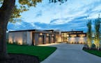 This modern lake home in Mahtomedi was designed by PLAAD.