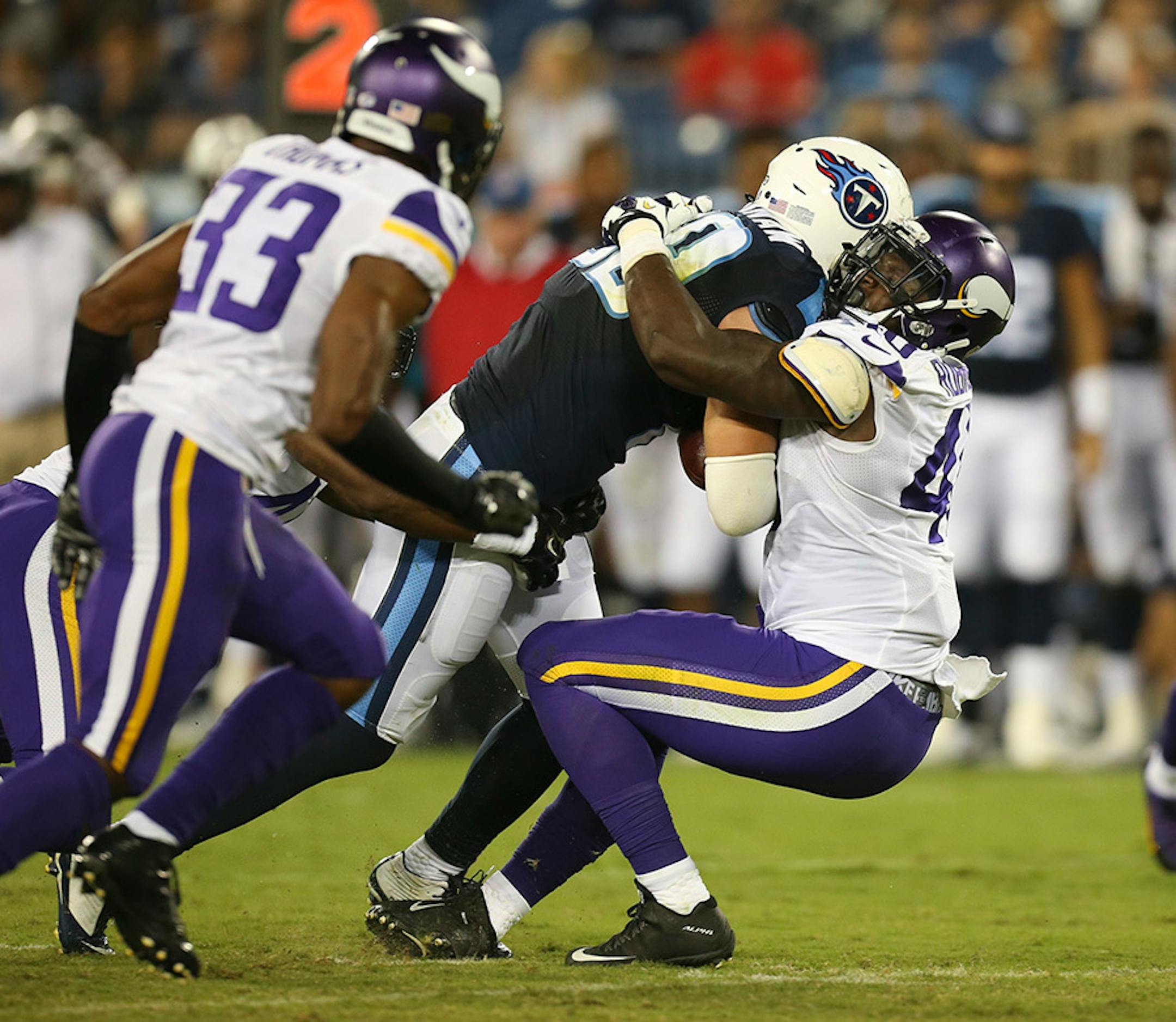 Vikings outside linebacker Edmond Robinson (40) stopped Tennessee Titans tight end Phillip Supernaw (89) on a run in the fourth quarter Thursday night.