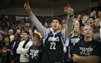 Fans watched the Timberwolves warm up before they scrimmaged during their first workout of the season early Tuesday morning at Bresnan Arena in Taylor