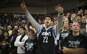 Fans watched the Timberwolves warm up before they scrimmaged during their first workout of the season early Tuesday morning at Bresnan Arena in Taylor