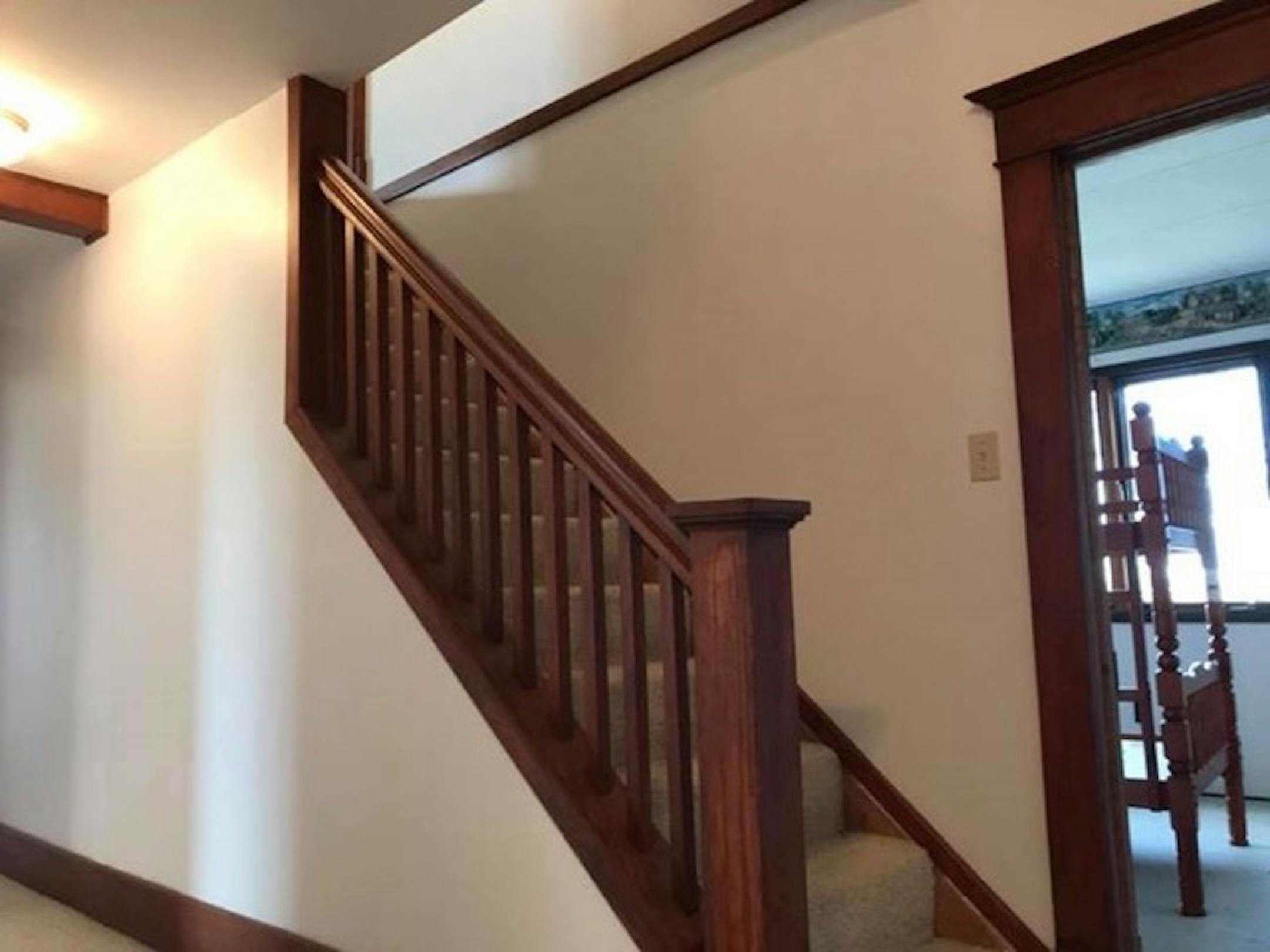 This Iowa farmhouse's owners restored the woodwork to its early 20th-century grandeur. They offered the house for free on Craigslist, and found a Minnesota taker. Courtesy Roger Dolecheck