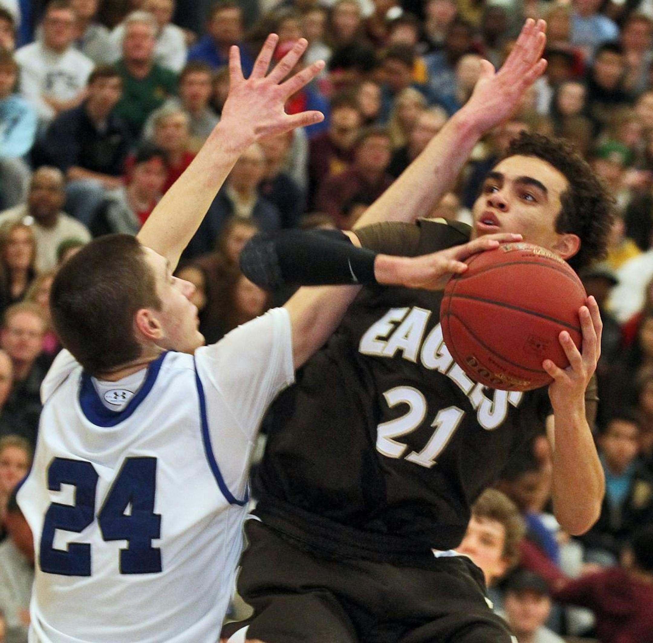 Apple Valley's Tyus Jones (21) has 39 points and 11 assists in this game against rival Eastview last season.
