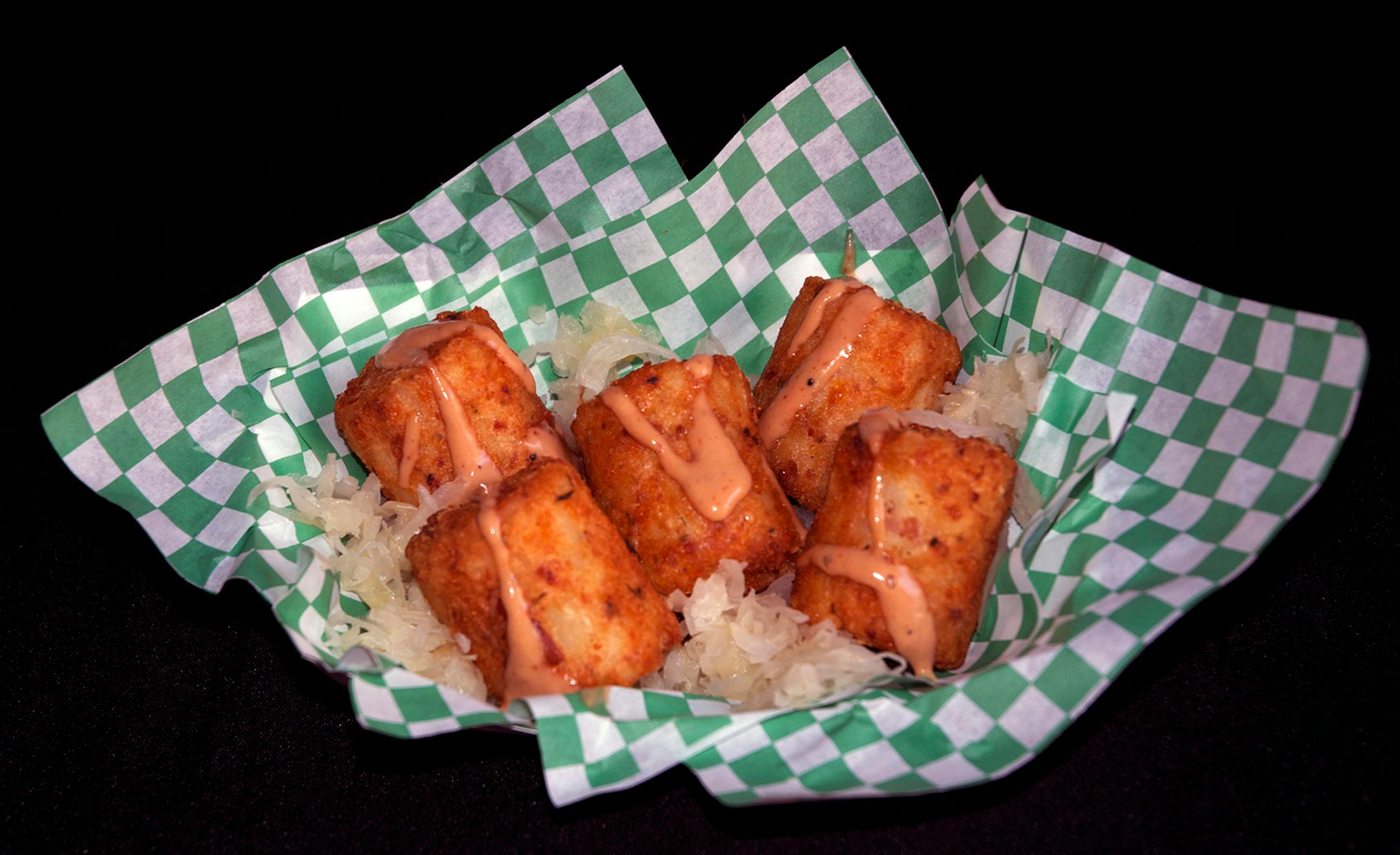 Irish Tater Kegs: Jumbo deep-fried tater tots made with a blend of corned beef, sauerkraut, Swiss cheese, sour cream and potatoes drizzled with house-made Thousand Island dressing and nestled on a bed of sauerkraut. At O'Gara's at the Fair, located on the southwest corner of Dan Patch Av. & Cosgrove St.