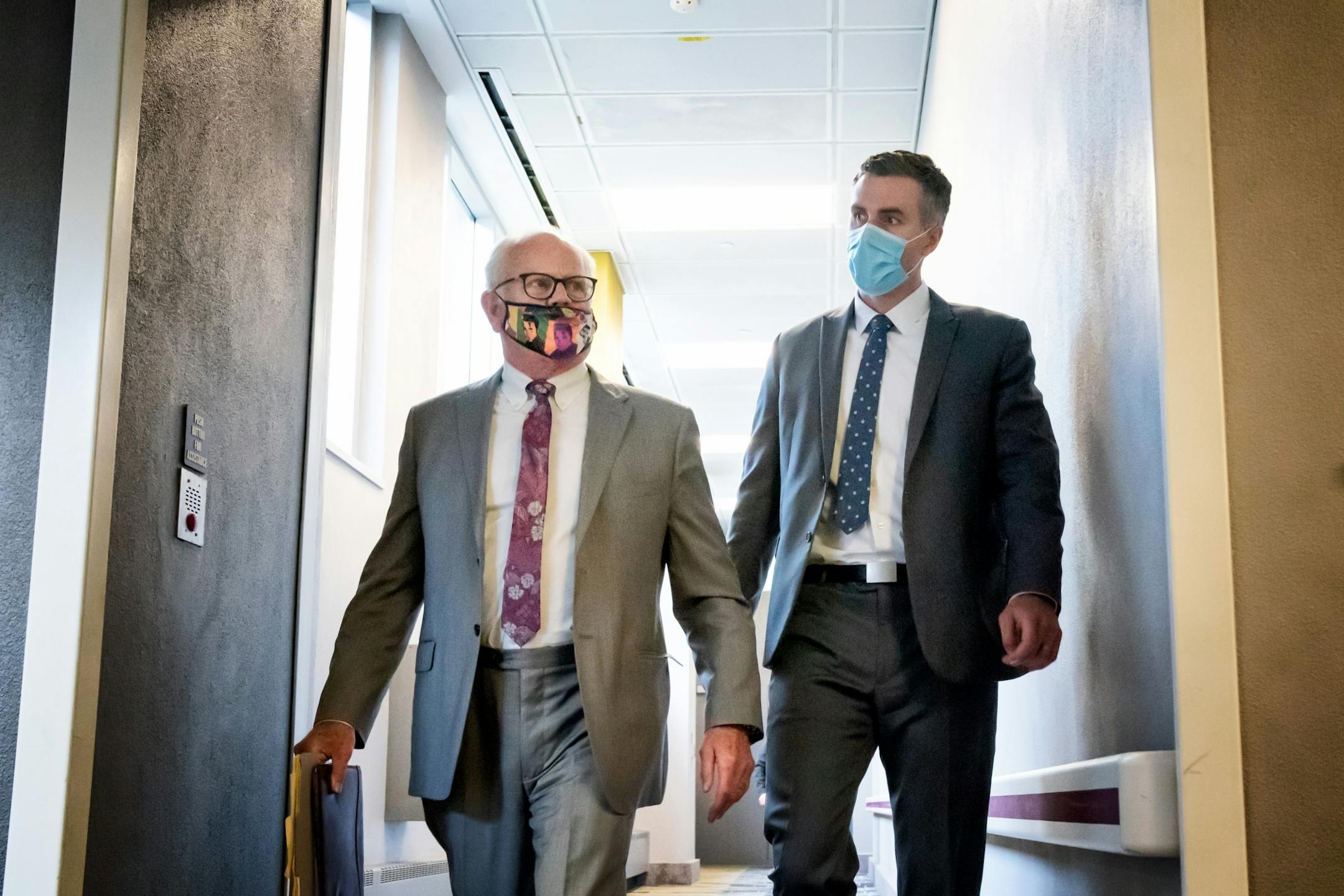 Former Minneapolis police officer Thomas Lane, right, walked out of the Hennepin County Public Safety Facility Monday afternoon with his attorney Earl Gray, left.