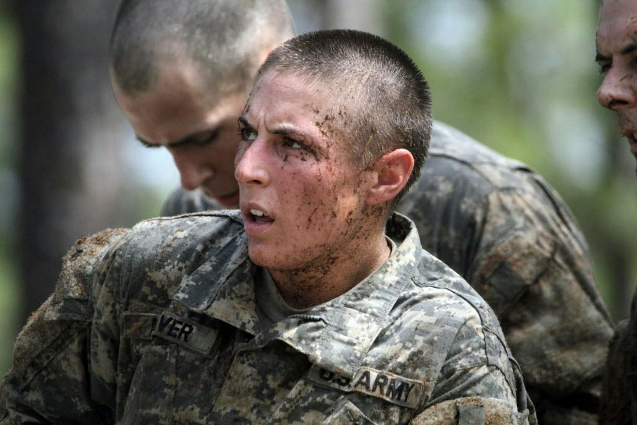 In this April 26, 2015, photo, 1st Lt. Shaye Haver, one of the 20 female soldiers, who is among the 400 students who qualified to start Ranger School, tackles the Darby Queen obstacle course, one of the toughest obstacle courses in U.S. Army training, at Fort Benning, in Ga.