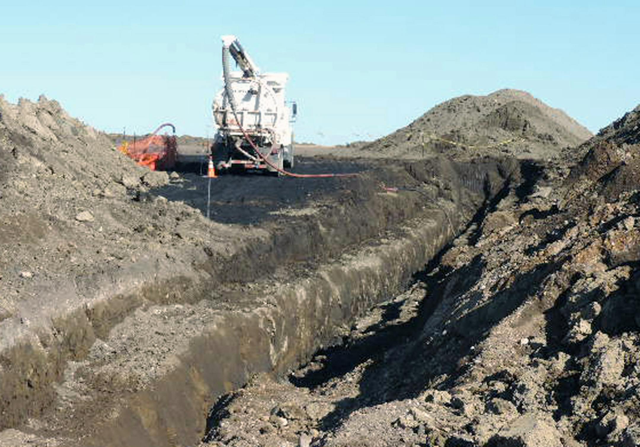 Oct. 8, 2013: A vacuum trucks cleans up oil in near Tioga, N.D. The North Dakota Health Department says more than 20,000 barrels of crude oil have spewed out of a Tesoro Corp. oil pipeline in a wheat field in northwestern North Dakota.