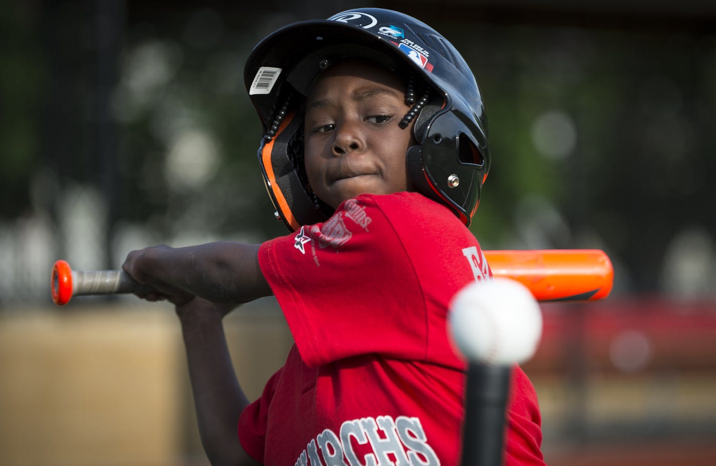 Ja'Kiya, 7, prepared to hit the ball during a scrimmage against older Monarchs players in late May. ] Aaron Lavinsky &#x2022; aaron.lavinsky@startribune.com The latest attempt by city park officials to get young black children, mostly boys, but also a few girls, interested in baseball is using the old Negro Leagues in an attempt to rekindle interest in a sport many African-Americans have fallen away from. At Farview, a city park where gunshots and broken homes are too often a way of life, the jo