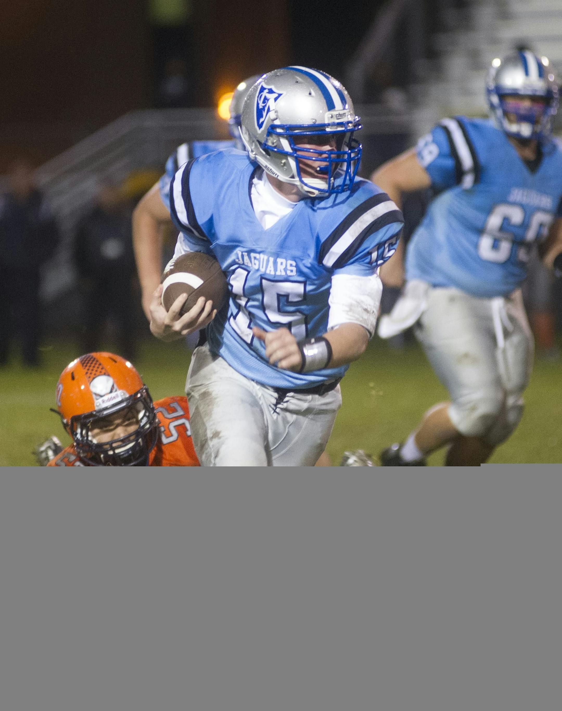 Jefferson's quarterback Zachary Ubben sheds a tackle, Thursday, October 2, 2014 while playing Cooper at Jefferson High School. ] (Matthew Hintz, 100214, Bloomington)