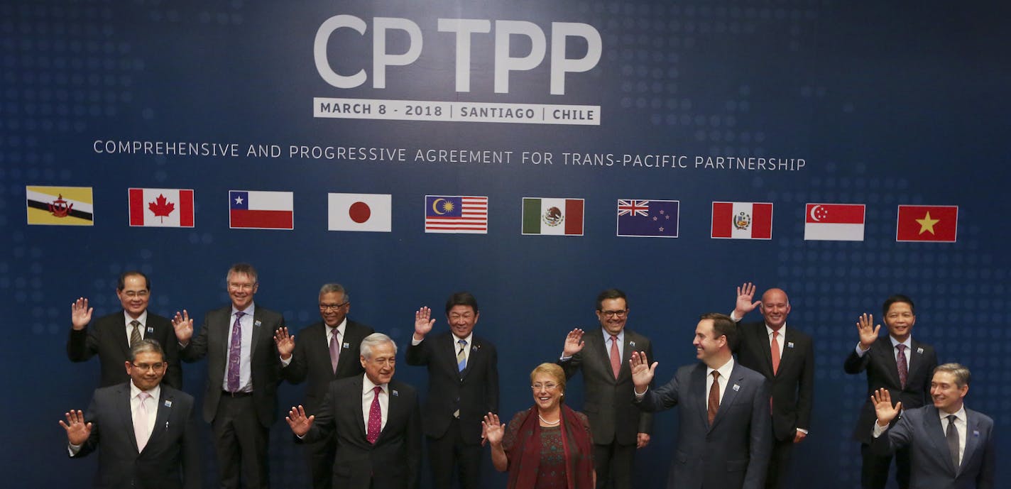 From left front row, Brunei's Foreign Minister Haji Erawan bin Pehin Yusof, Chile's Foreing Minister Heraldo Munoz, Chile's President Michelle Bachelet, Australian Minister for Trade and Investment Steven Ciobo, Canada's Minister of International Trade Francois-Philippe Champagne, and from left back row, Singapore's Minister for Trade and Industry Lim Hng Kiang, New Zealand Trade Minister David Parker, General Secretary Ministry of International Trade and Industry of Malaysia Y.Bhg. Datuk J. Jay