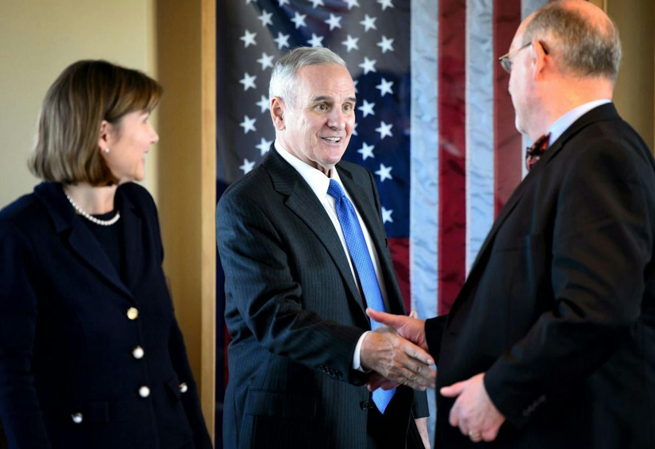 Governor Mark Dayton greeted Health Commissioner Dr. Ed Ehlinger at the start of the Ebola meeting.