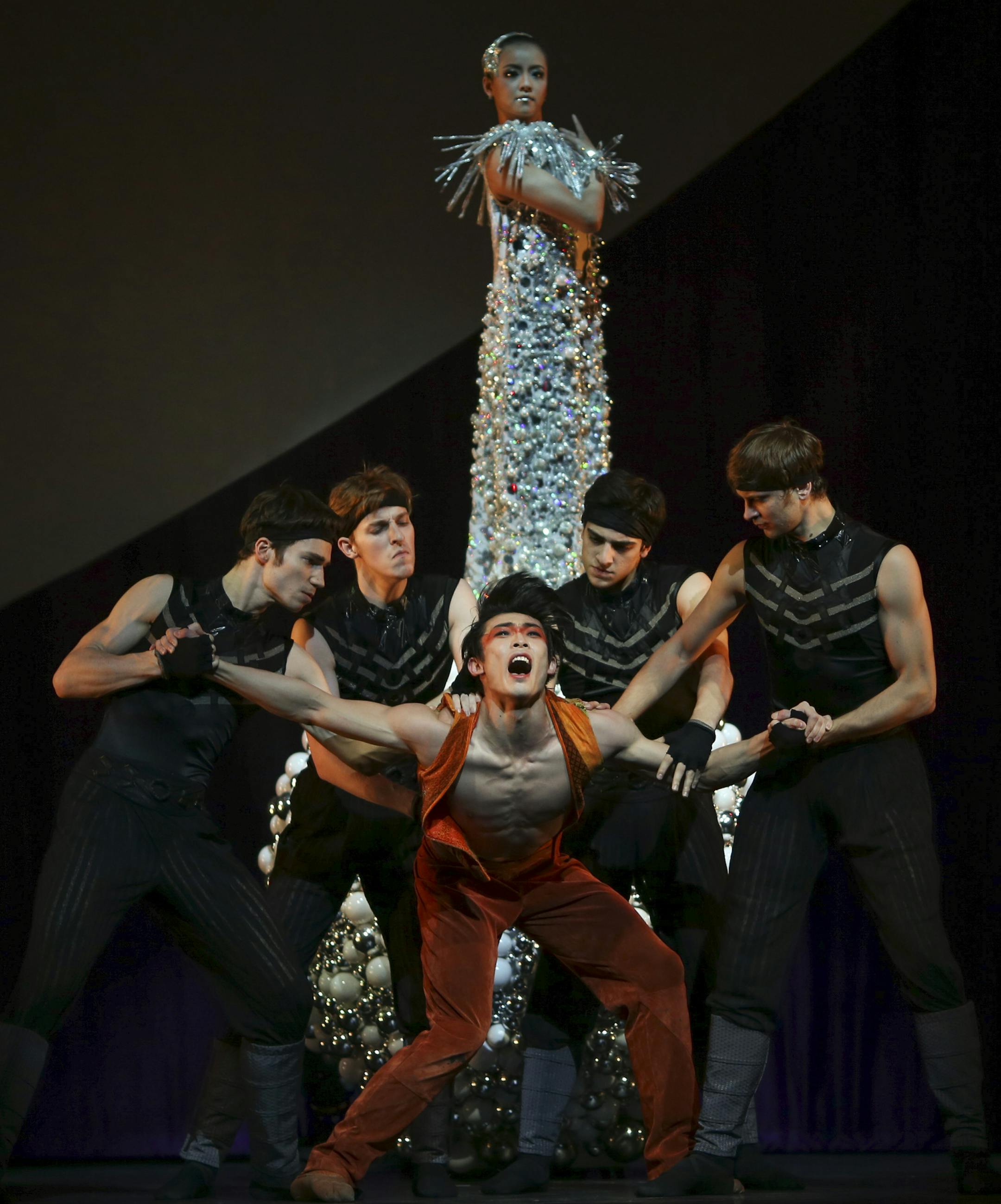 Li Jia-Bo as Calaf is restrained by phantoms of suitors who fell in love with Turandot, played by Zhang Si Yuan, rear, in a scene from the first act of Turandot during a dress rehearsal Thursday afternoon at Northrop. ] JEFF WHEELER • jeff.wheeler@startribune.com The Hong Kong Ballet performed Turandot Thursday and Friday nights on the Carlson Family Stage at Northrop on the U of M's Minneapolis campus. The cast held a dress rehearsal Thursday afternoon, November 6, 2014.