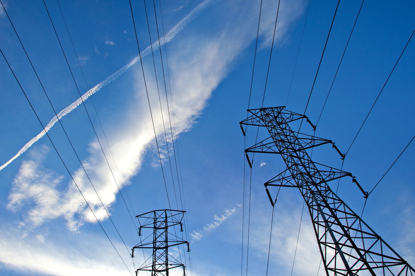 Power transmission lines are suspended from electricity pylons in Clifton, New Jersey, U.S., on Tuesday, Aug. 17, 2010. U.S. electrical output rose 6.2 percent to 94,254 gigawatthours from a year earlier during the week ending Aug. 14. About 45 percent of U.S. electricity will come from coal plants and 22 percent from natural gas power facilities this year, according to the Energy Department. Photographer: Steve Hockstein/Bloomberg ORG XMIT: 103645948 ORG XMIT: MIN1312041507220842