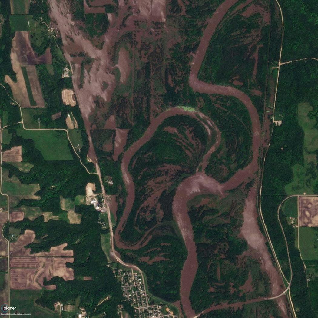 This satellite image shows an aerial view of Henderson on June 24, following dramatic flooding of the Minnesota River in the Sibley County town. 
