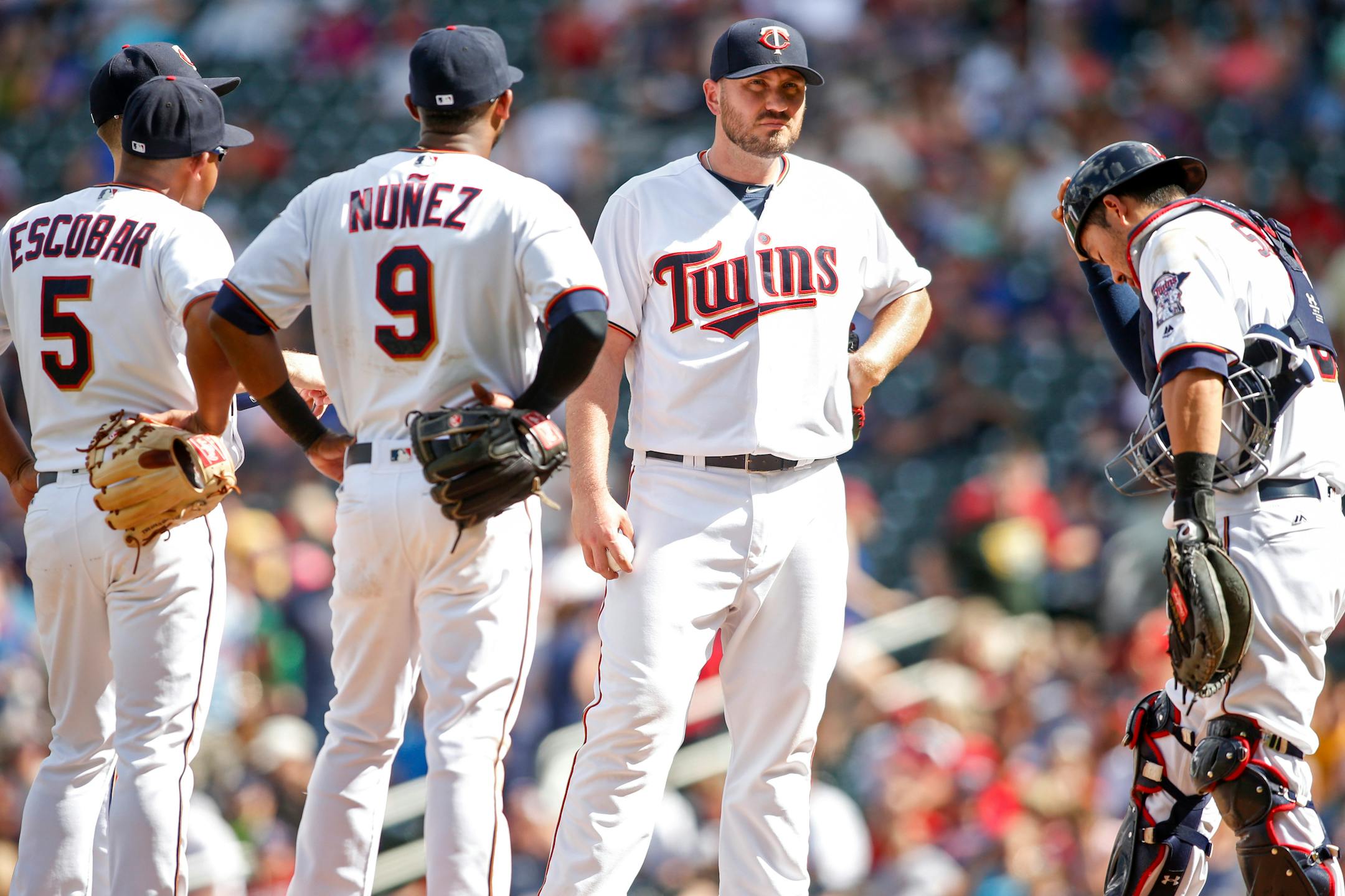 Twins relief pitcher Kevin Jepsen, second from right, waited for manager Paul Molitor to relinquish the ball against the Rays in the ninth inning Sunday.