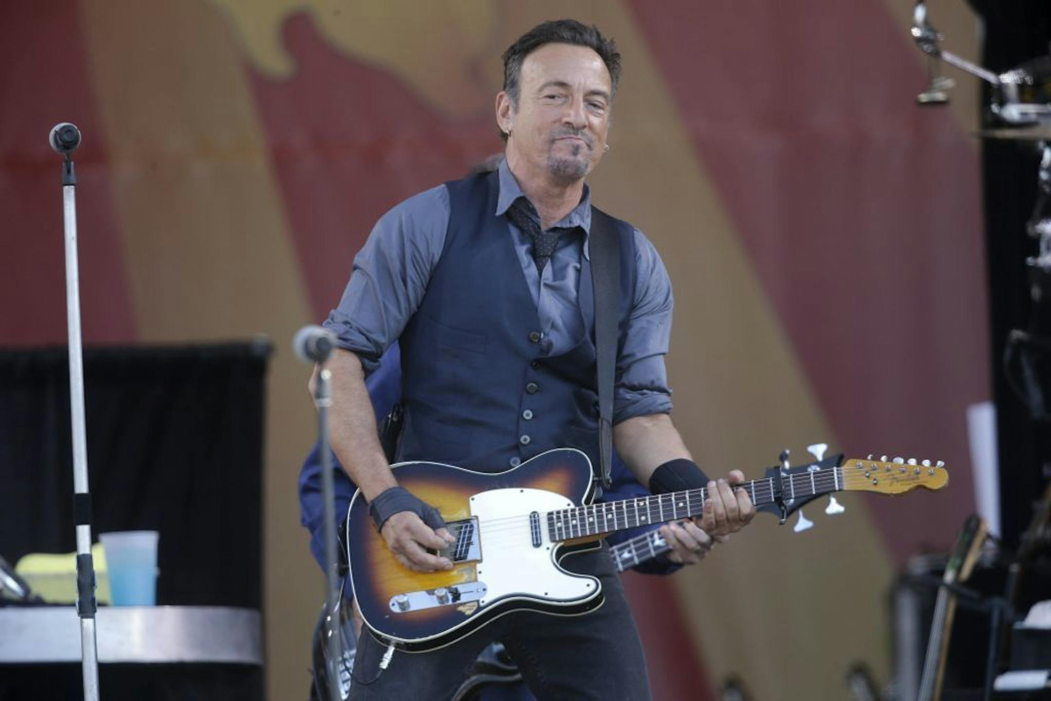 Bruce Springsteen performs at the New Orleans Jazz and Heritage Festival in New Orleans, Saturday, May 3, 2014.