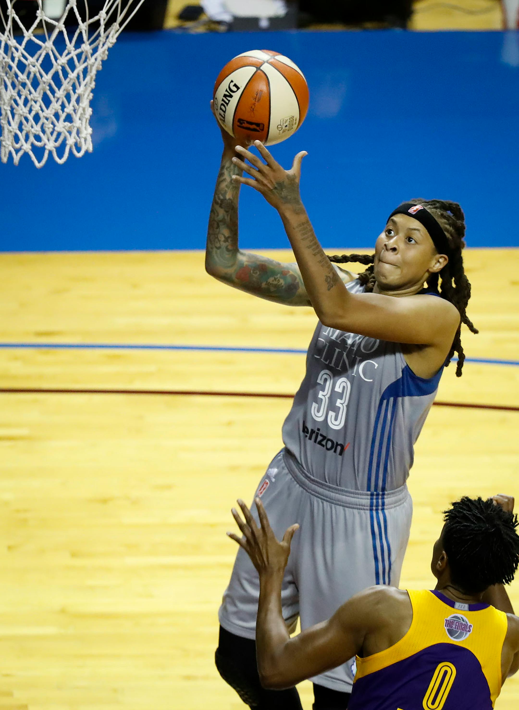 Minnesota Lynx guard Renee Montgomery (21) jumped for a shot in the second half. The Sparks won 85-84.